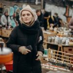 Boxhagener Platz Market Woman in Black Jacket and Gray Knit Cap