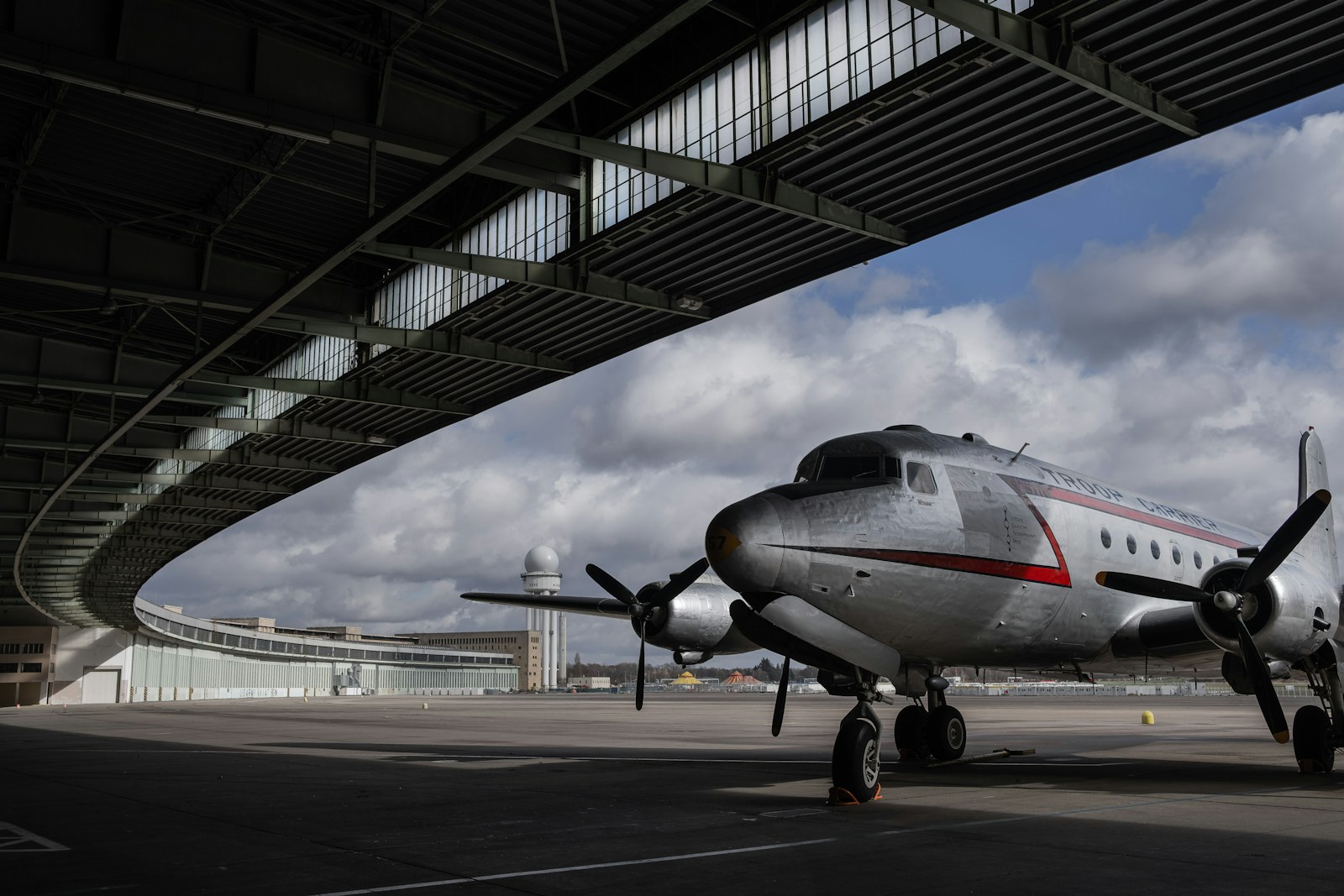 Discover the top airports in Berlin. Plan your trip with ease and find the best travel options. Explore now! -black and white airplane on airport during daytime